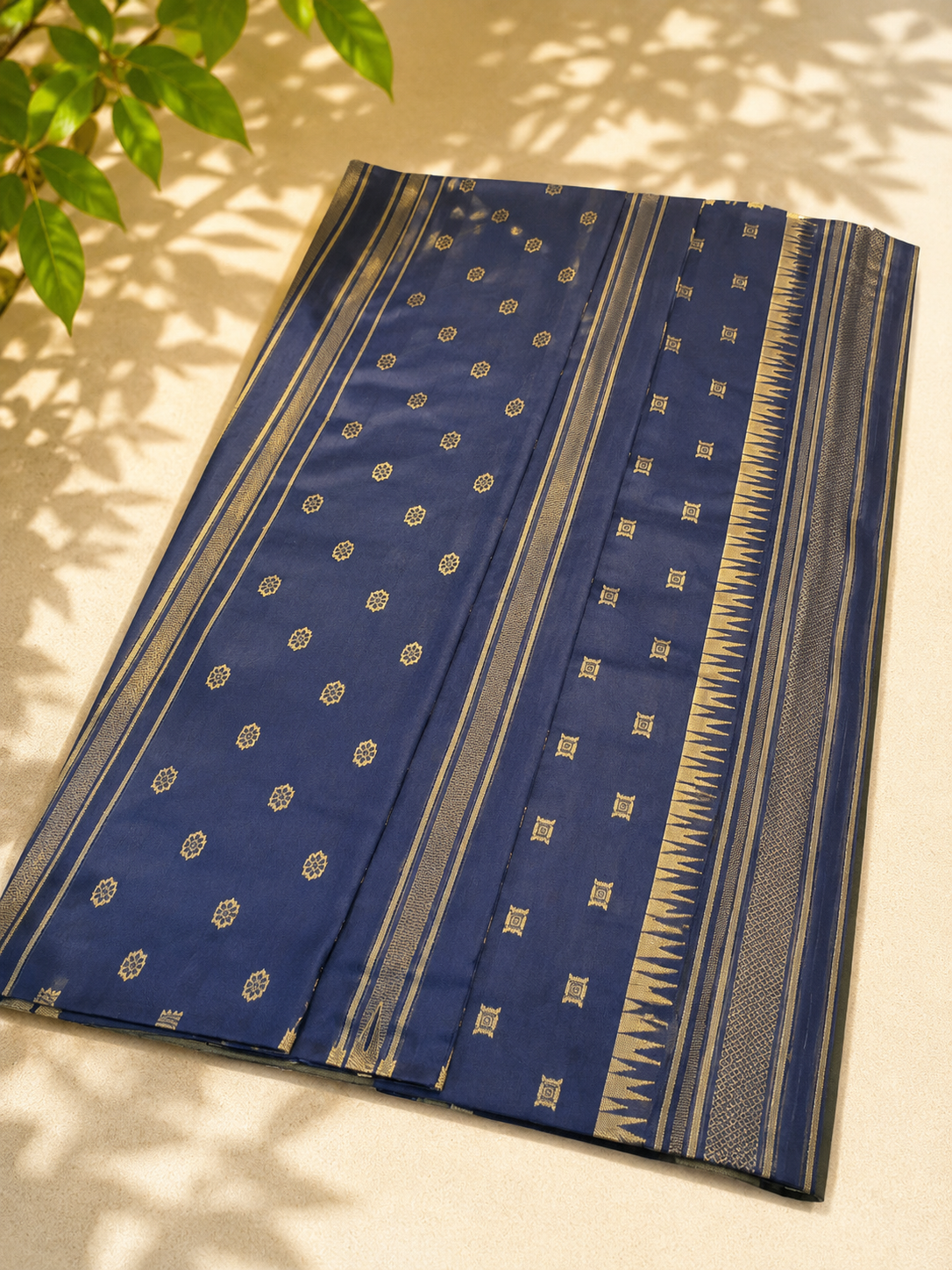 Semi-Silk Kanjivaram Saree – Gold with Navy Blue Temple Border & Bhutta Work